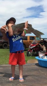 Ledger Lewallen, 4, of Omega caught the biggest striped bass hybrid at last week-end's Canton Walleye Rodeo. The fish weighed 9.73-pounds.
