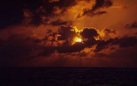 Sunset behind clouds in Mexico